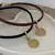 Choker 35Cm Camurça Pingente Mandala Ferradura - comprar online