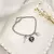 PULSEIRA PRATA FECHO IMÃ CORAÇÃO ESP.SANTO INICIAL