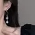 Estilo coreano moda longo cobre brincos de corte redondo gemas sintéticas nupci - loja online