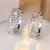 Brincos de argola cruzados de pedra pequena de zircônia branca para mulheres vi - comprar online