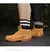 Botas altas de cuero para hombre y mujer, zapatos de alta calidad, zapatillas de deporte para exteriores, botines antideslizantes con cordones. - comprar en línea