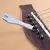 1pc metal guitarra corda extrator de madeira folk pry up corda cônico unhas gui