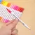 Kit Livro de Colorir + 18 Canetas Brush - comprar online