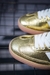 Tênis Adidas Samba – Dourado Metálico com Listras Brancas e Solado Gum - comprar online