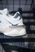 Tênis New Balance 9060 – Branco com Azul Marinho e Detalhes Off-White