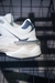 Tênis New Balance 9060 – Branco com Azul Marinho e Detalhes Cinza