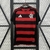 Camisa oficial do Flamengo 2025/26 com listras horizontais vermelhas e pretas, logo do clube e da Adidas na frente