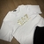 Imagem do T-SHIRT EMPÓR1O ARM4NI BRANCA - LOGO DOURADA