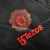 Jaqueta Corta-Vento Manchester United 23/24 - Masculina Adidas - Preta com detalhes em vermelho e azul - loja online