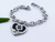 Pulsera de acero quirúrgico de corazón con flor