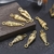 Dije caracol laminado en oro real/goldfilled