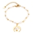 Pulsera dorada con perlas alargadas y dije de luna