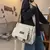 Bolsa crossbody unissex despojada na internet