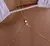 Corrente de Barriga Estrela Dourada – Charme e Delicadeza no Seu Estilo na internet