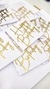 topos de bolo em papel com a frase "Happy Birthday" em dourado