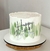 Bolo de aniversário decorado com as palavras "Happy Birthday" em uma estética elegante com detalhes em verde.