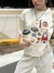Remera Cool Items Crema
