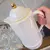 Garrafa Térmica para Café e Chá em Plástico Branco com Detalhes Dourados - 1L