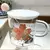 Caneca Decorativa de Vidro com Tampa de Cerâmica Branca e Colher de Metal - 400 ml