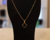 Colar Veneziana Pingente Trevo Preto Banhado à Ouro - comprar online