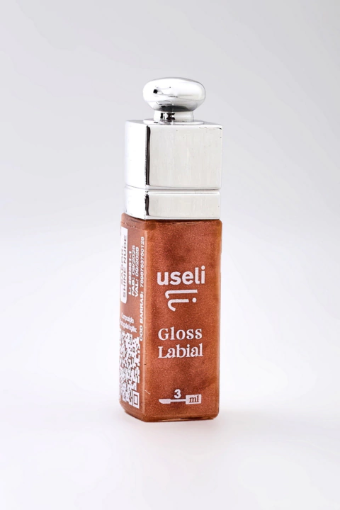Mini gloss labial Useli Shine Tutti Frutti na cor bronze com embalagem quadrada e tampa prateada