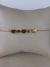 Pulseira Cinco Corações Liso Aço Inox 316L Dourado na internet