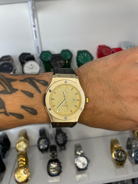 HUBLOT GENEVE - DOURADO/REVESTIDO EM COURO