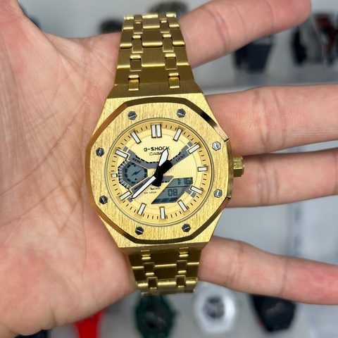 GSHOCK CASIO GM 2100 STEEL - DOURADO/PULSEIRA DE AÇO/A PROVA D ÁGUA/43,5 MM