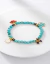 Bracelete Turquesa Com Charms Proteção, Alegria E Estilo - comprar online
