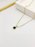 Colar ponto de luz preto - ouro na internet