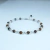 Pulsera tejida con ojo de tigre
