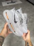 Tênis Nike Vomero Premium - Cinza/Laranja - comprar online