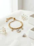 Pulseira Feminina de Aço Inoxidável Banhado a Ouro Com Corrente de Bolinhas e Pingente Argola