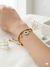 Pulseira om Contas De Titânio Banhadas a Ouro e Cravejadas com Cristais - E&J BIJOUTERIAS