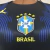 Camisa feminina da Seleção Brasil II 26/27 nas cores azul e preto com detalhes em amarelo, logo da CBF e símbolo Jordan