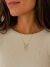 Colar Nossa Senhora design oval cravejado detalhes flores - comprar online