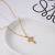 Colar Cruz Cravejada - Auroria - Semijoias Banhadas a Ouro 18K e Hipoalergênicas 