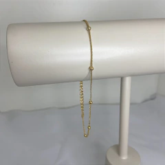 TORNOZELEIRA COM BOLINHAS DOURADAS