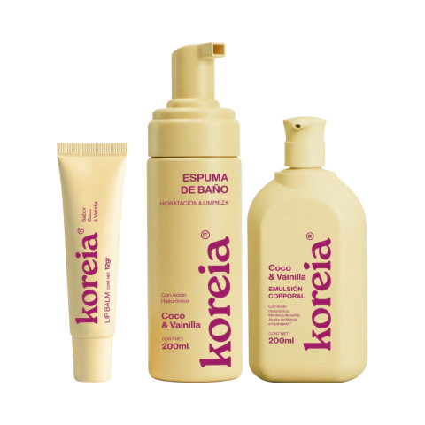 Set corporal de productos para el cuidado de la piel con aroma a coco y vainilla, incluye bálsamo labial, espuma de baño y emulsión corporal en envases beige.