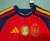 camisa-seleção-espanha-I-home-patch-campeão-copa-do-mundo-2026-jogador-adidas-masculina-cor-vermelha-th-mantos-br