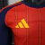 camisa-seleção-espanha-home-patch-campeão-copa-do-mundo-2026-jogador-manga-longa-adidas-cor-vermelha-th-mantos-br