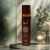 Frasco do Body Splash Asad Bourbon Isabelle la Belle 300ml em fundo com vidro fosco, vela acesa e flores brancas