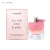 Frasco de perfume Lancôme La Vie Est Belle Vanille Nude com embalagem rosa claro ao lado