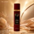 Frasco do Body Splash Sabah Al Ward Isabelle La Belle 300ml em fundo dourado com flores brancas e tecido acetinado