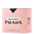 Embalagem rosa texturizada do perfume Prada Paradoxe Eau de Parfum, com detalhes em preto e texto em preto e branco.