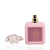 Frasco rosa do perfume Shams Al Emarat Pink Blush com tampa transparente removida ao lado