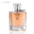 Frasco de perfume feminino Dream Brand Collection número 012 com líquido rosado e tampa transparente
