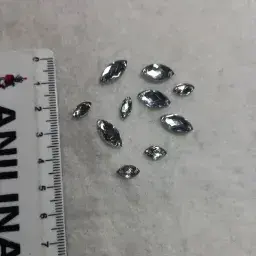 Gema coser ojo gato 7*18mm x 200 unid