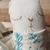 Ajuar de bienvenida con muñeco de apego y eco vela - greengift