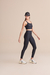 Mulher vestindo Legging academia Live! Preta icon neo, em pose lateral 